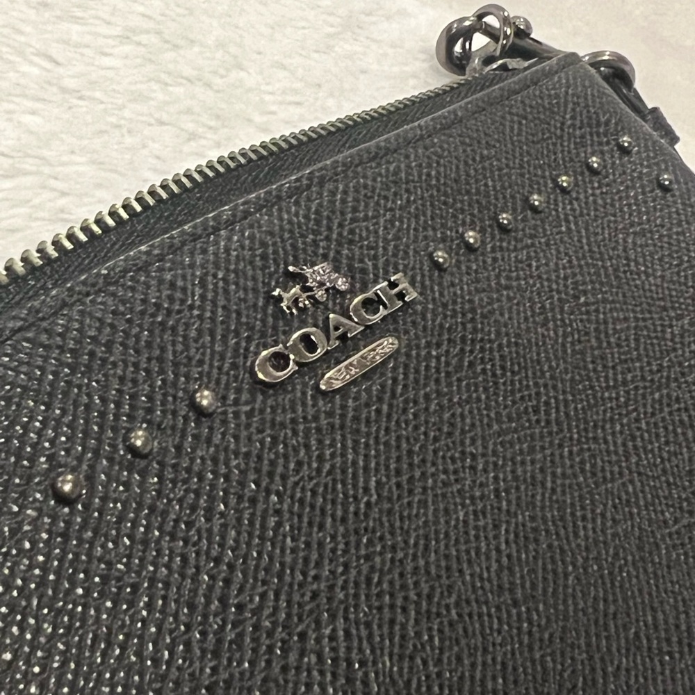 Coach wristlet. Black leather with mini gunmetal studs.